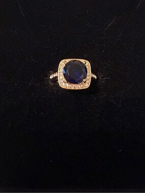 Stainless Steel Gold Overlay with Deep Blue Center Stone and Pavé Halo Ring.